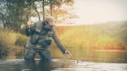Naklejka premium Fisherman. Fly fishing.