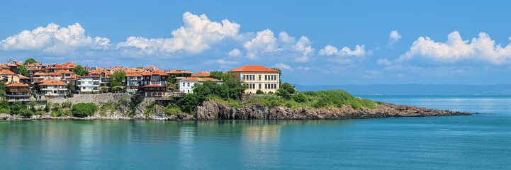 Fototapeta na wymiar Panoramic view of the east cape of Sozopol Old Town (former ancient town of Apollonia) with building of Art Gallery, Bulgaria. Sozopol is the famous seaside resort on the Bulgarian Black Sea Coast.