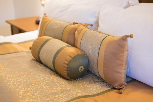 King Size Bed Decorated With Silk Pillows In Hotel Thailand