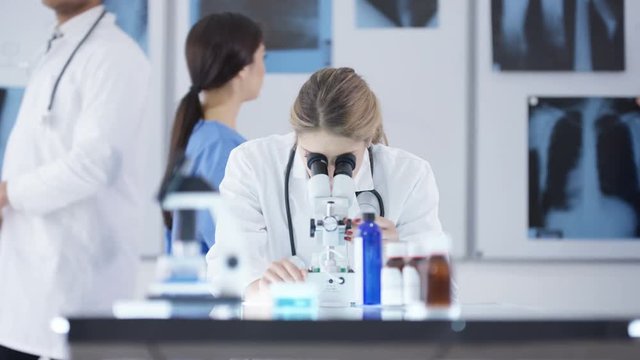  Medical researcher working in the lab analyzing pharmaceuticals