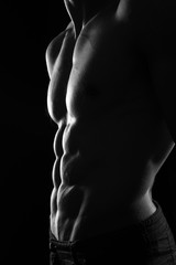 Muscular Torso of Sexy Shirtless Young Male Model Close Up on Black Background - 143438567