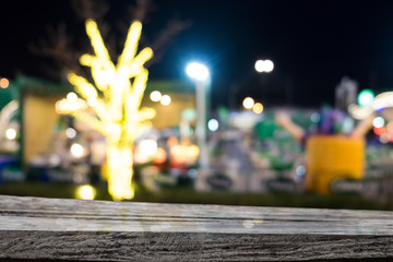 Table top free space and blurred night market with street bokeh lights.For product display montage. Business presentation.