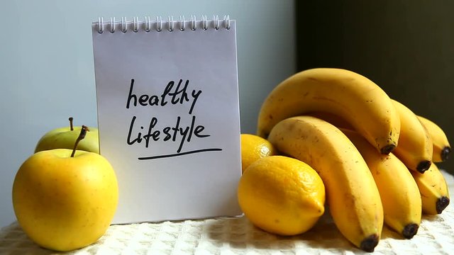 Healthy lifestyle words with yellow fruits