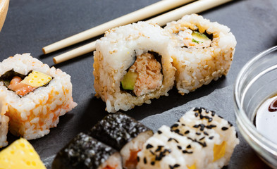 Slate tray of assorted sushi