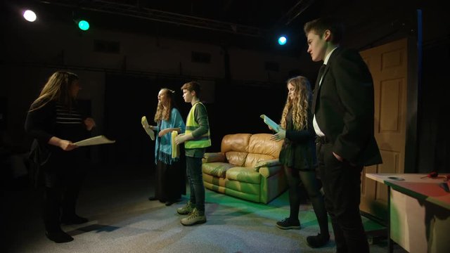  Young student actors in rehearsal for school theatre production