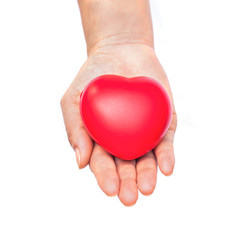 hand holding a red heart on white background