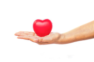 Fototapeta premium hand holding a red heart on white background