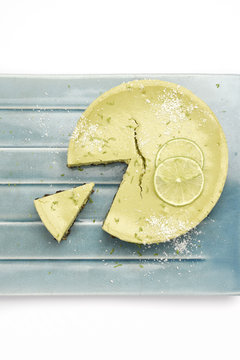 Matcha and chocolate cheesecake with coconut powder and lime