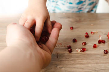 A child eating a pomegranate