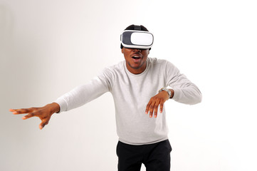 Black guy with virtual reality glasses isolated on white