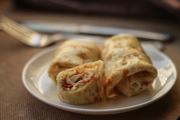 Pancakes with filling (stewed cabbage with vegetables)