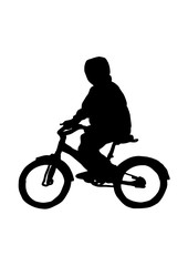 Obraz na płótnie Canvas Silhouette of a boy on a bicycle vector