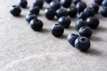 Blueberries in on gray stone
