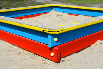 Sandbox, red blue yellow