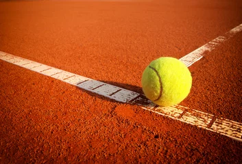 Fotobehang Tennis balls on a tennis clay court © Željko Radojko