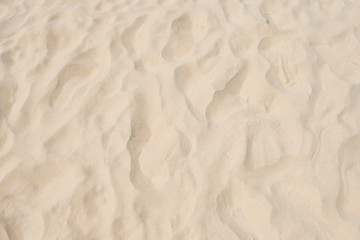 closeup of sand pattern of a beach in the summer