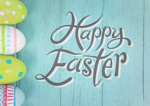 Grey easter graphic against teal table with eggs