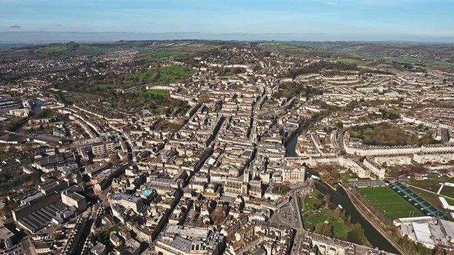 Aerial View of Bath Cityscape feat. Historical The Roman Baths, Bath Spa, Bath Pavilion and River Avon in England, UK - 4K 
