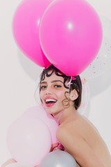 Happy pretty girl with party balloons