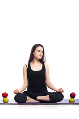 Girl is engaged in yoga on a white background, concept of health