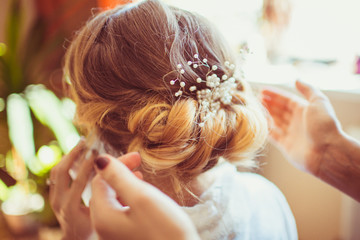 The beautiful hairdo has a bride