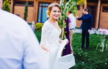 Naklejka premium The happinest bride goes to wedding ceremony