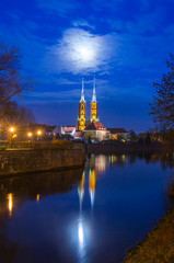Naklejka premium The Cathedral of St John Baptist by a full moon night Ostrow Tumski Wroclaw Breslau Poland