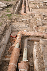 Abandoned water pipes in ditch