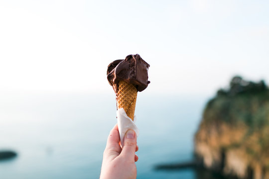 Hand holding gelato cone, Amalfi Italy.