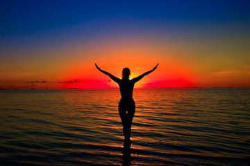Woman silhouette on water