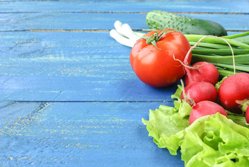 Fresh vegetables on a blue wooden surface