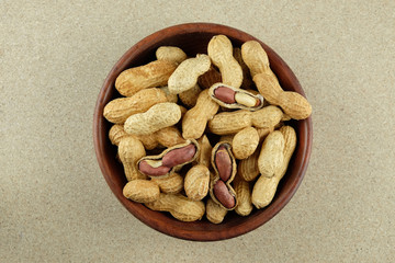 Peanuts in a wooden bowl.