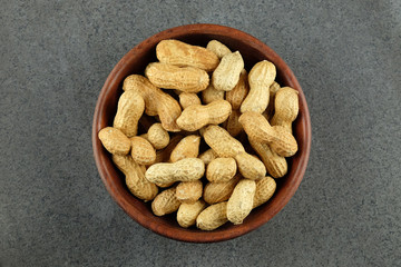Peanuts in a wooden bowl.