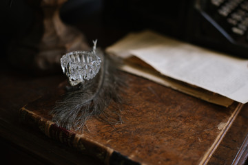 Black feather on a vintage book