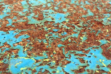 Rusty painted metal surface with blur effect.