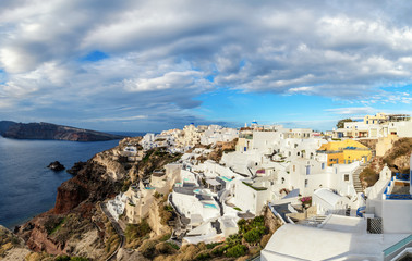 Santorini island in Greece, Oia village under dramatic sky
