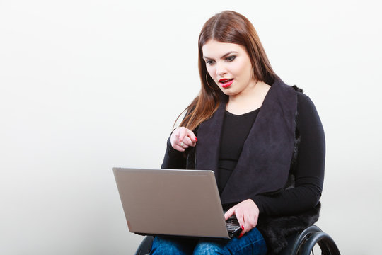 Crippled lady with laptop.