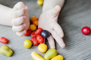 fruits in little child hands - kid