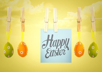 Grey type on note on washing line with eggs against yellow sky