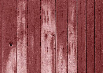 Wet red color wooden fence pattern.
