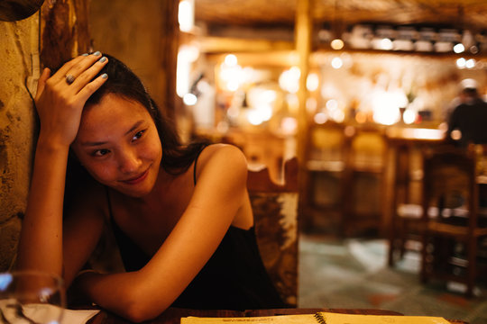 20 something relaxes at a restaurant in Old Havana, Havana Cuba