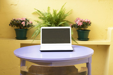 computer in the urban terrace in summer