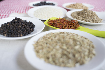 variety of spices on white saucers