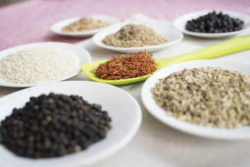 variety of spices on white saucers