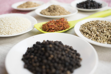 variety of spices on white saucers