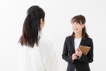 asian businesswomen talking on white background