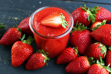 Fresh strawberry smoothie on wooden table