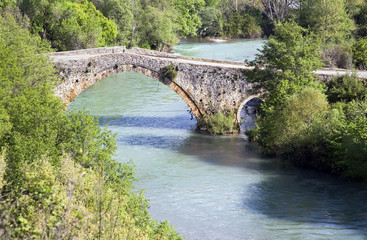 Fototapeta na wymiar Alaköprü historical bridge on Dragonda River Mersin Turkey