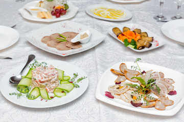 Table served with various dishes in restaurant