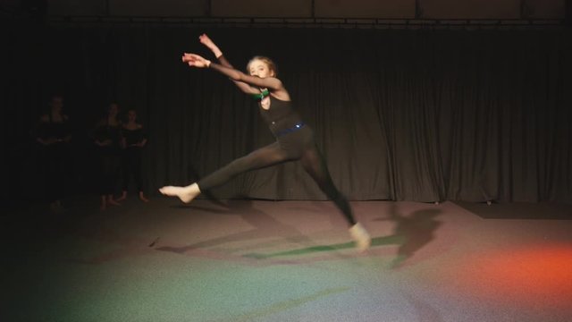  Young student in dance rehearsal for school theatre production